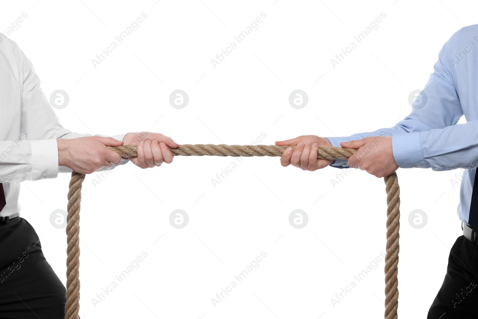 Photo of Dispute concept. Men pulling rope on white background, closeup