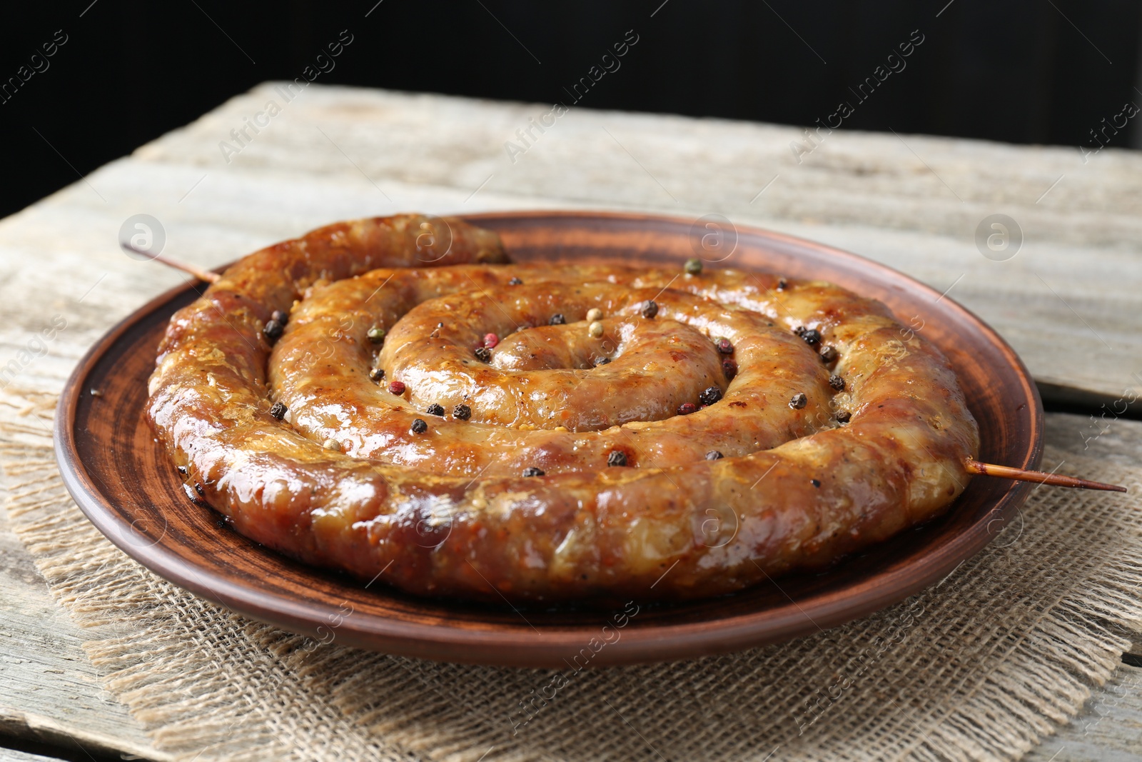 Photo of Plate with tasty homemade sausages on table, closeup