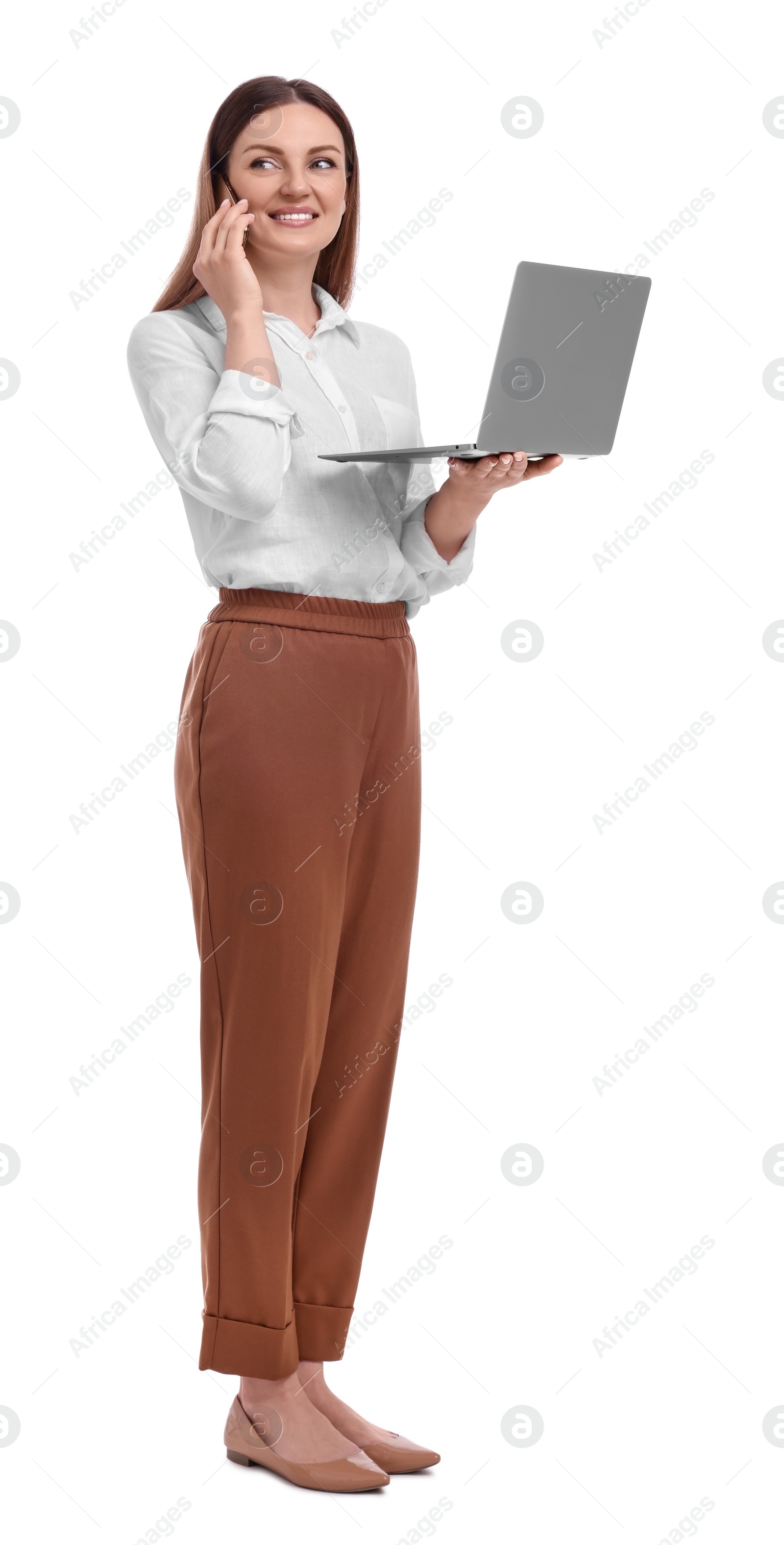 Photo of Beautiful businesswoman with laptop talking on phone against white background