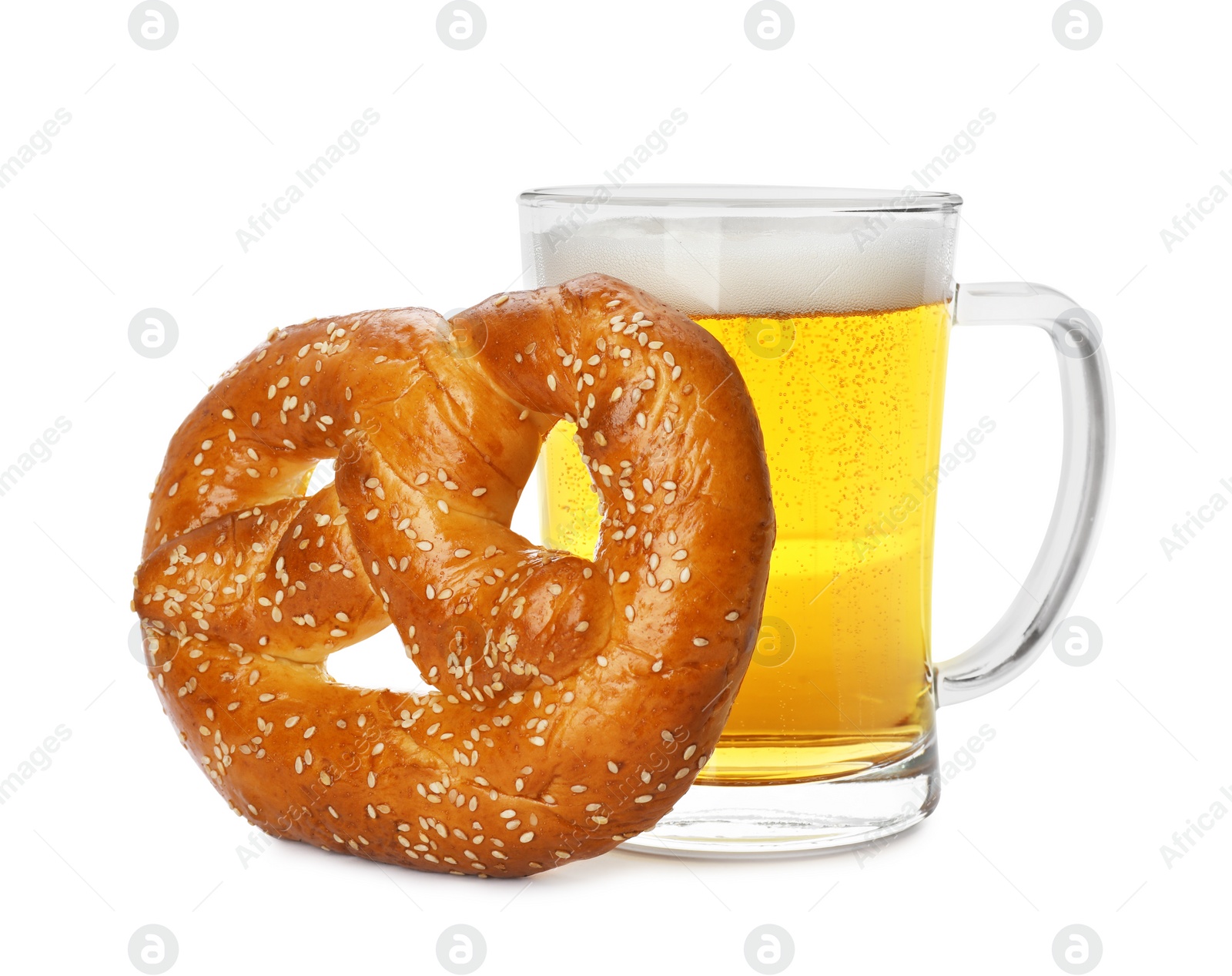 Photo of Tasty freshly baked pretzel and mug of beer on white background