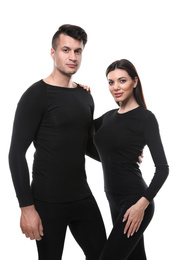 Couple wearing thermal underwear isolated on white