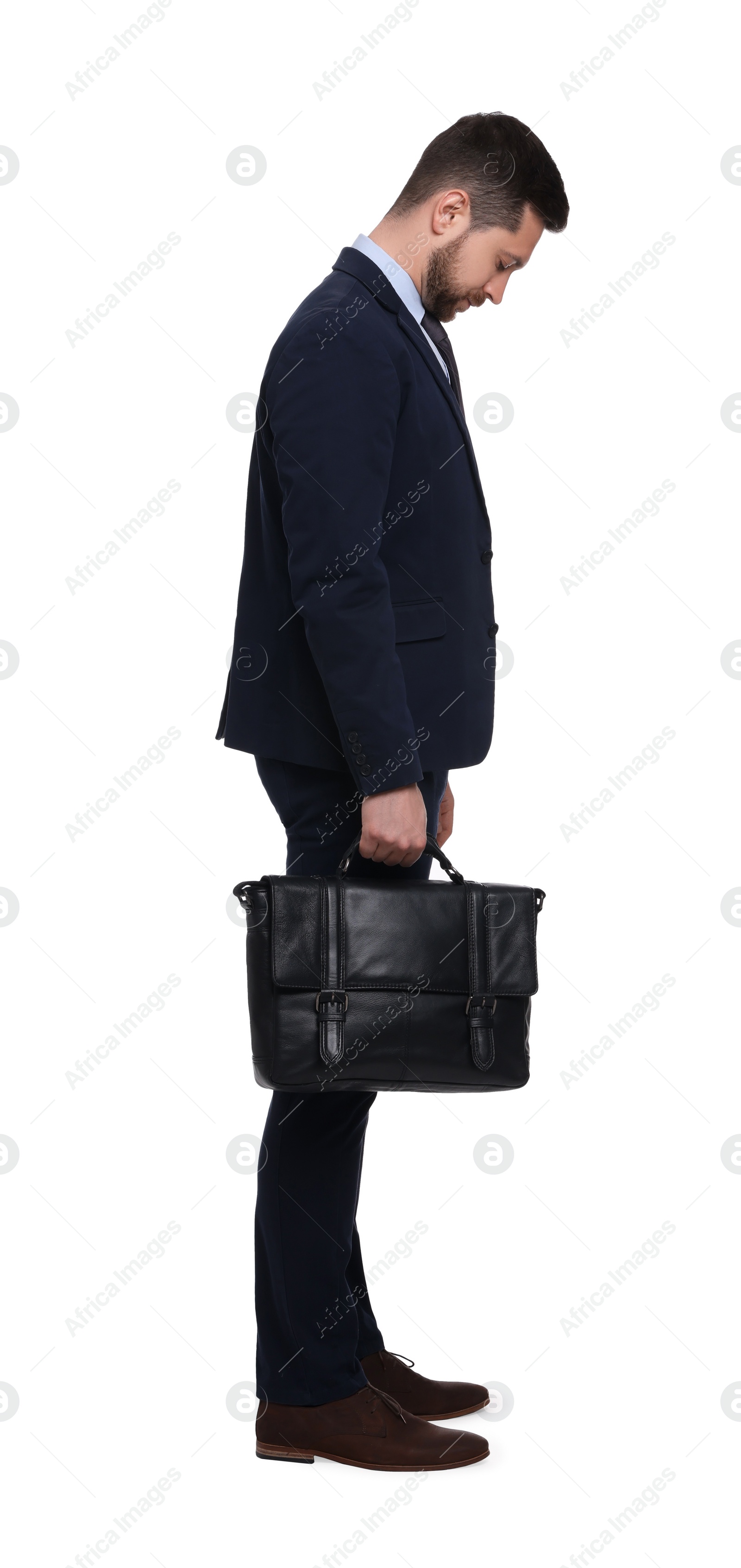 Photo of Handsome bearded businessman in suit with briefcase on white background