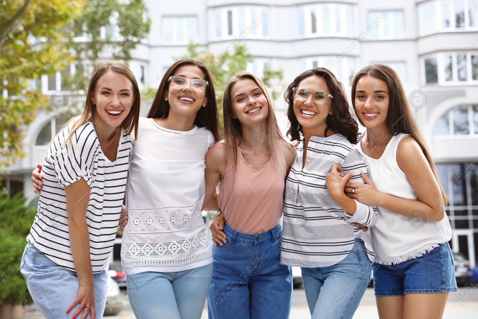 Photo of Happy women outdoors on sunny day. Girl power concept