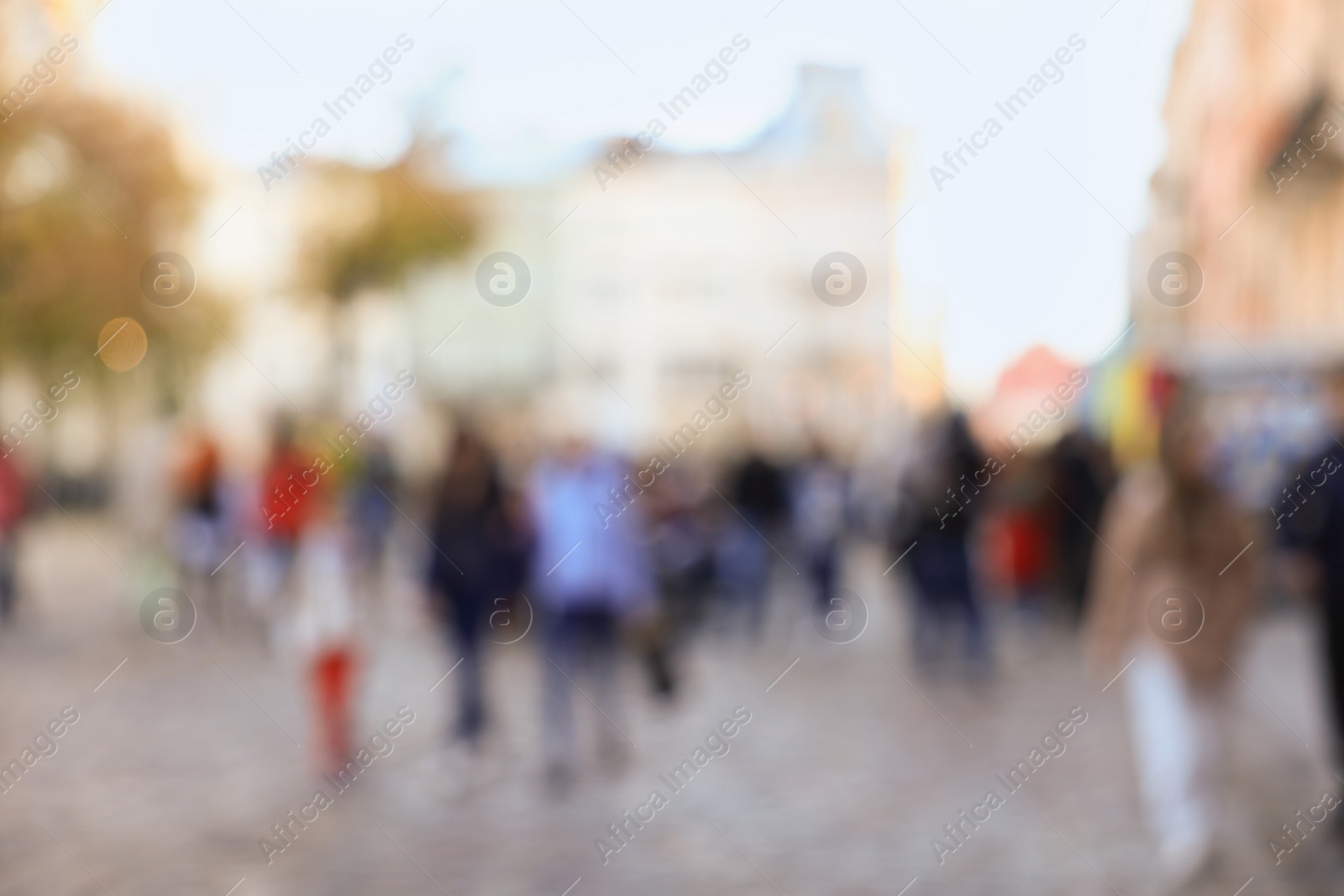 Photo of Blurred view of people walking on city street