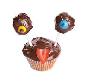 Photo of Delicious dessert decorated as monster on white background. Halloween treat