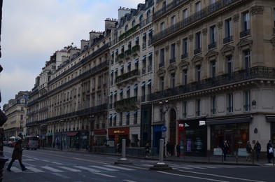 Paris, France - December 10, 2022: City street with beautiful architecture and road