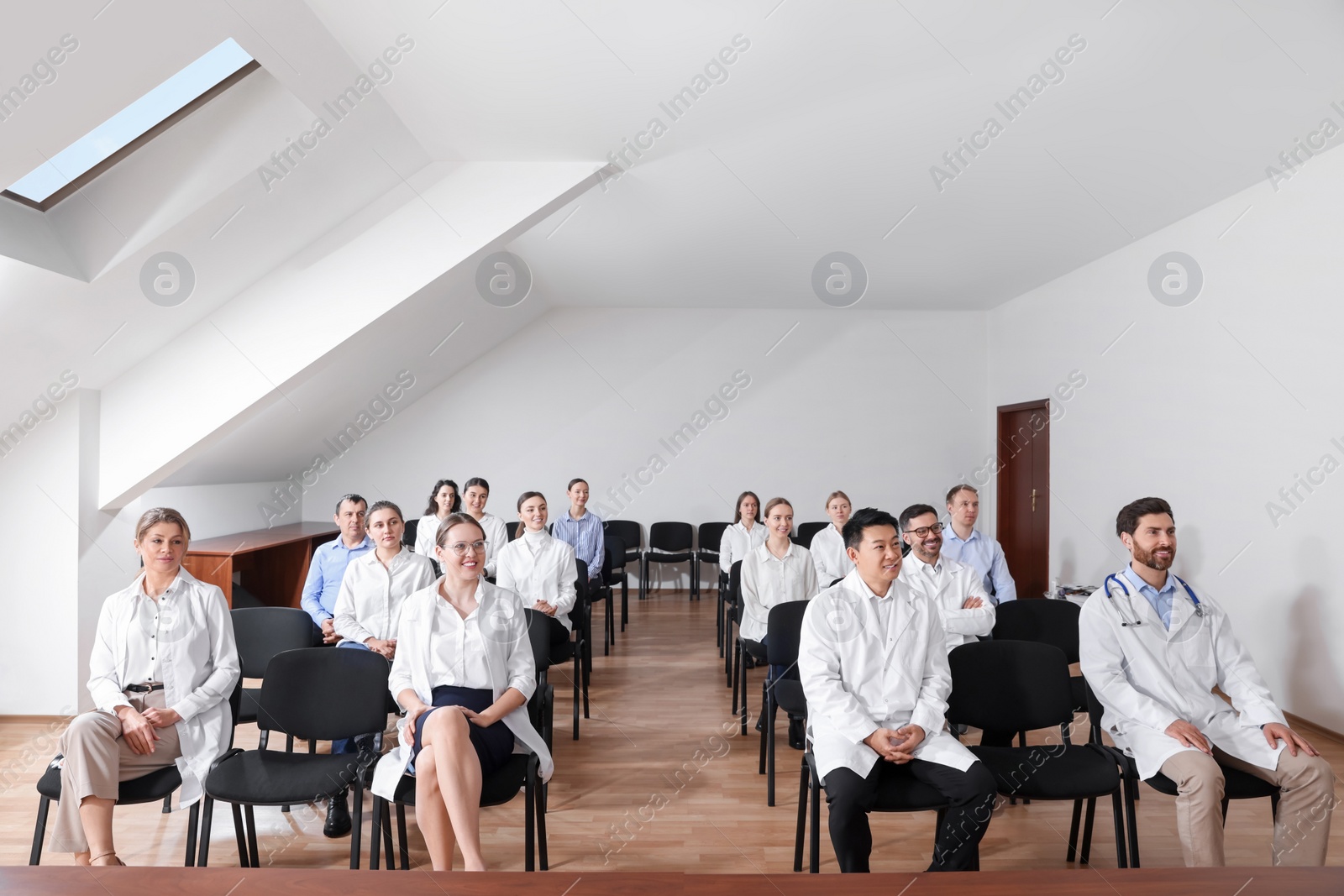 Photo of Team of doctors in meeting room during medical conference