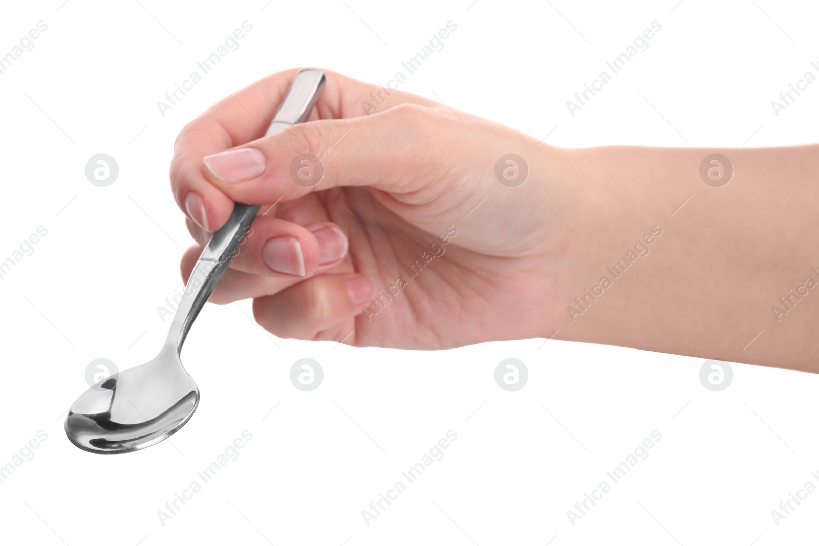 Photo of Woman holding new shiny spoon on white background, closeup