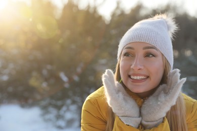 Photo of Woman enjoying winter day in forest, space for text