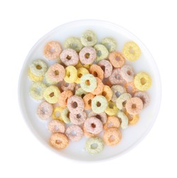 Photo of Tasty colorful cereal rings and milk in bowl isolated on white, top view