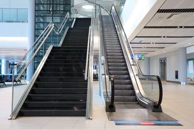 Photo of ISTANBUL, TURKEY - AUGUST 13, 2019: Interior of new airport terminal with stairs and escalator