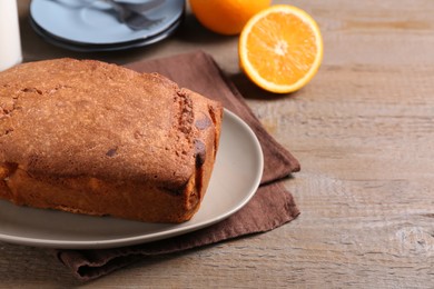 Photo of Fresh delicious cake served on wooden table, closeup. Space for text