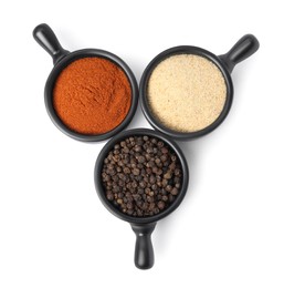Photo of Bowls with different spices on white background, top view