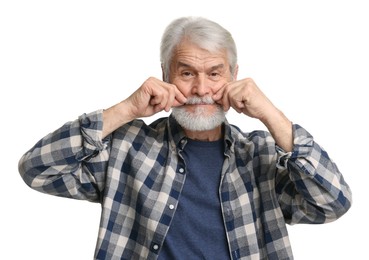 Senior man touching mustache on white background