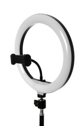 Photo of Modern ring light on stand against white background