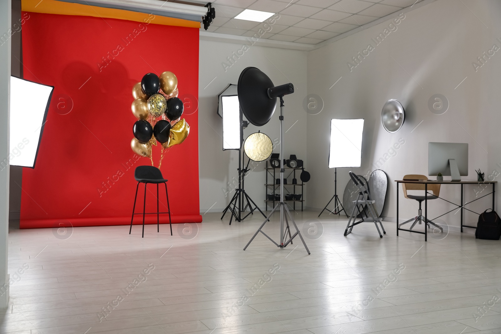 Photo of Interior of modern photo studio with professional equipment