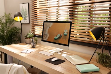 Photo of Comfortable workplace near window in room. Interior design