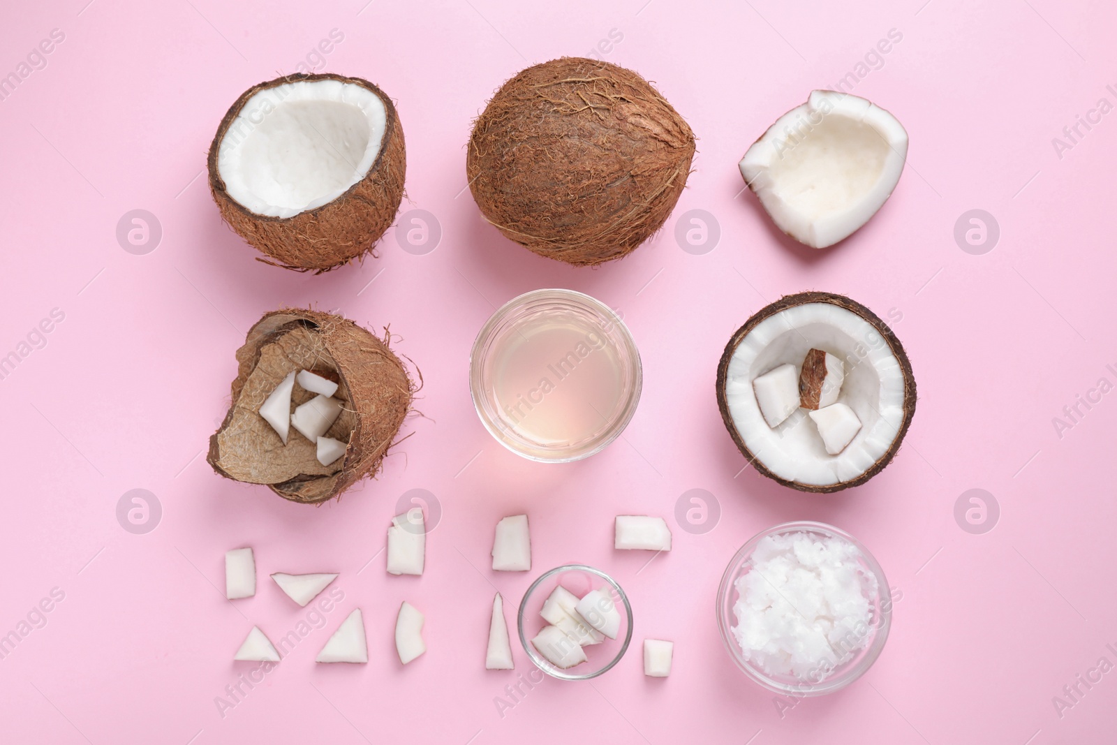 Photo of Flat lay composition with coconut oil on pink background