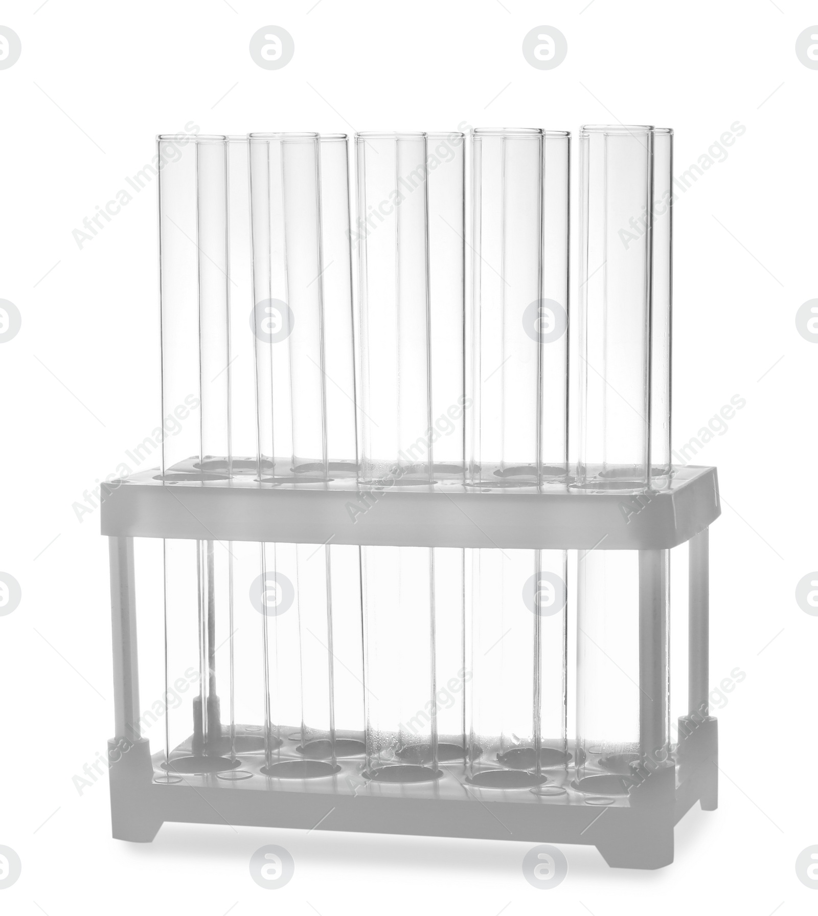 Photo of Empty test tubes in rack isolated on white. Laboratory glassware