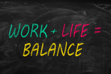 Image of Work-life balance concept. Sum with words written on chalkboard