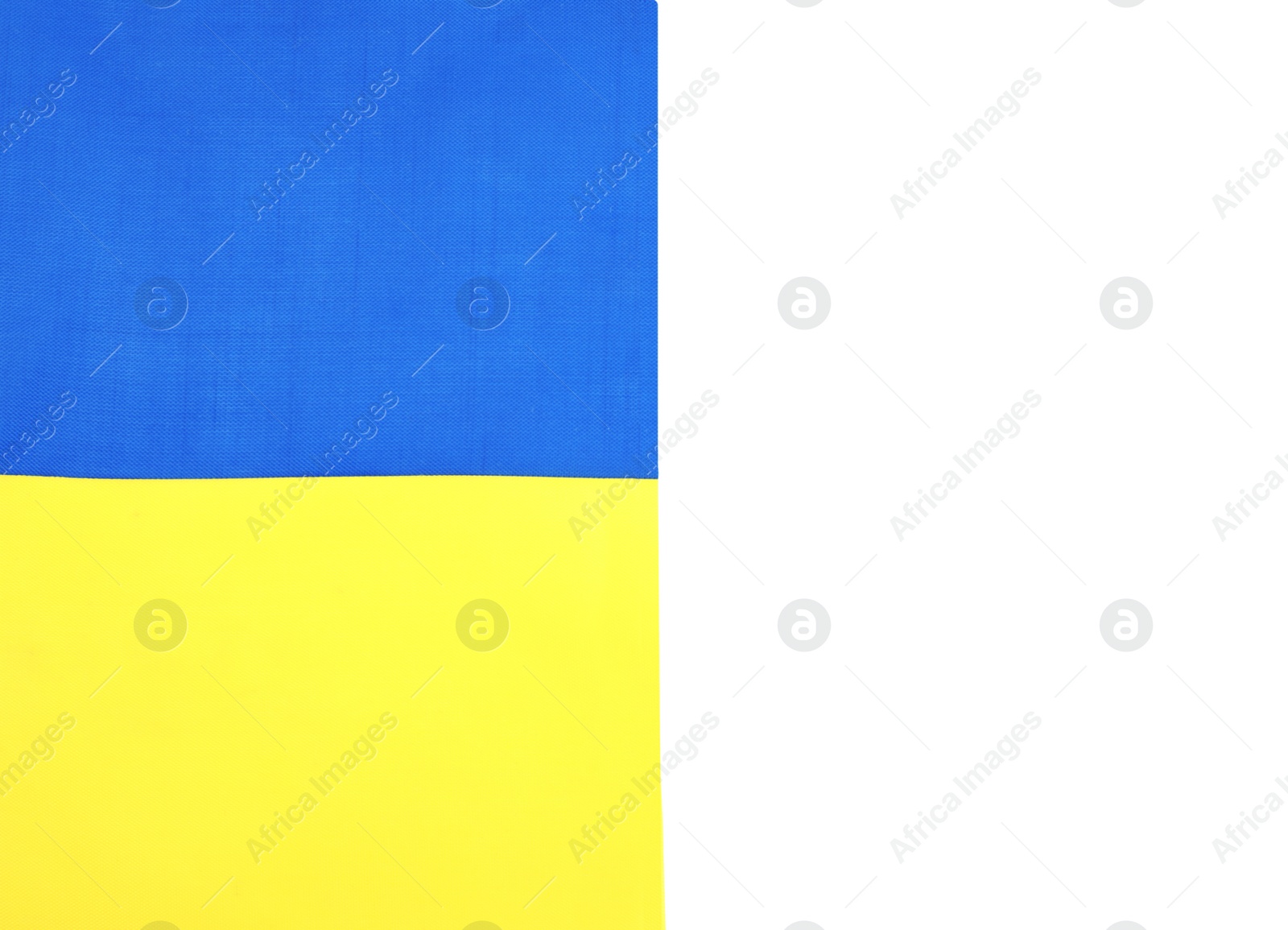 Photo of National flag of Ukraine isolated on white, top view