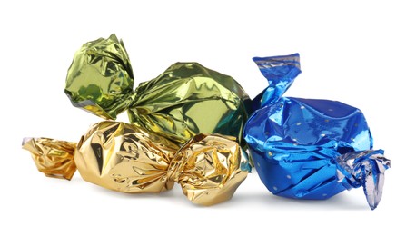 Photo of Candies in colorful wrappers isolated on white