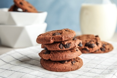 Photo of Stack of tasty chocolate chip cookies on table