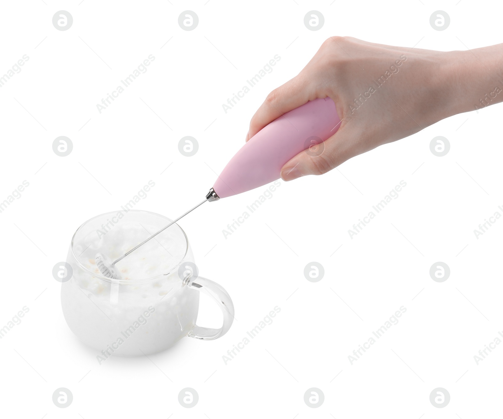 Photo of Woman whisking milk in cup with mini mixer (frother wand) isolated on white