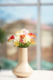 Beautiful bouquet of freesia flowers indoors