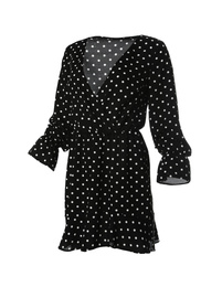 Photo of Beautiful short black polka dot dress on white background