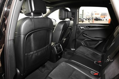 Inside of modern car with black leather seats