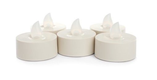 Photo of Decorative flameless LED candles on white background