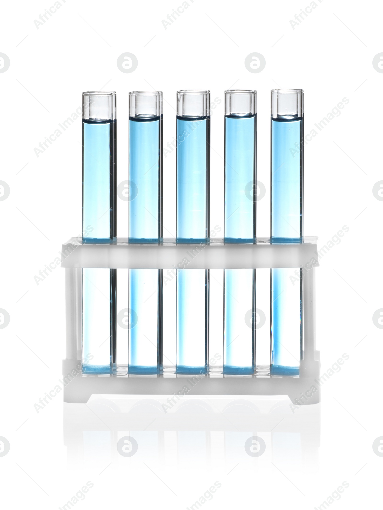 Photo of Test tubes with blue liquid isolated on white. Laboratory glassware