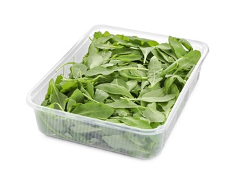 Photo of Fresh arugula in plastic container isolated on white