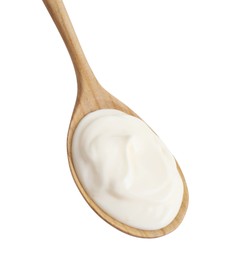 Photo of One wooden spoon with mayonnaise isolated on white