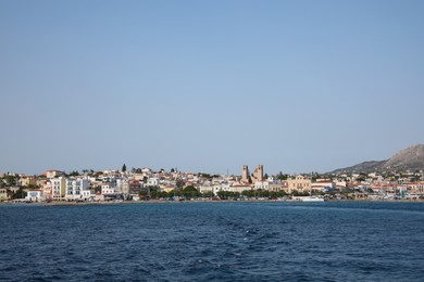 Photo of Beautiful view of sea and coastal city on sunny day