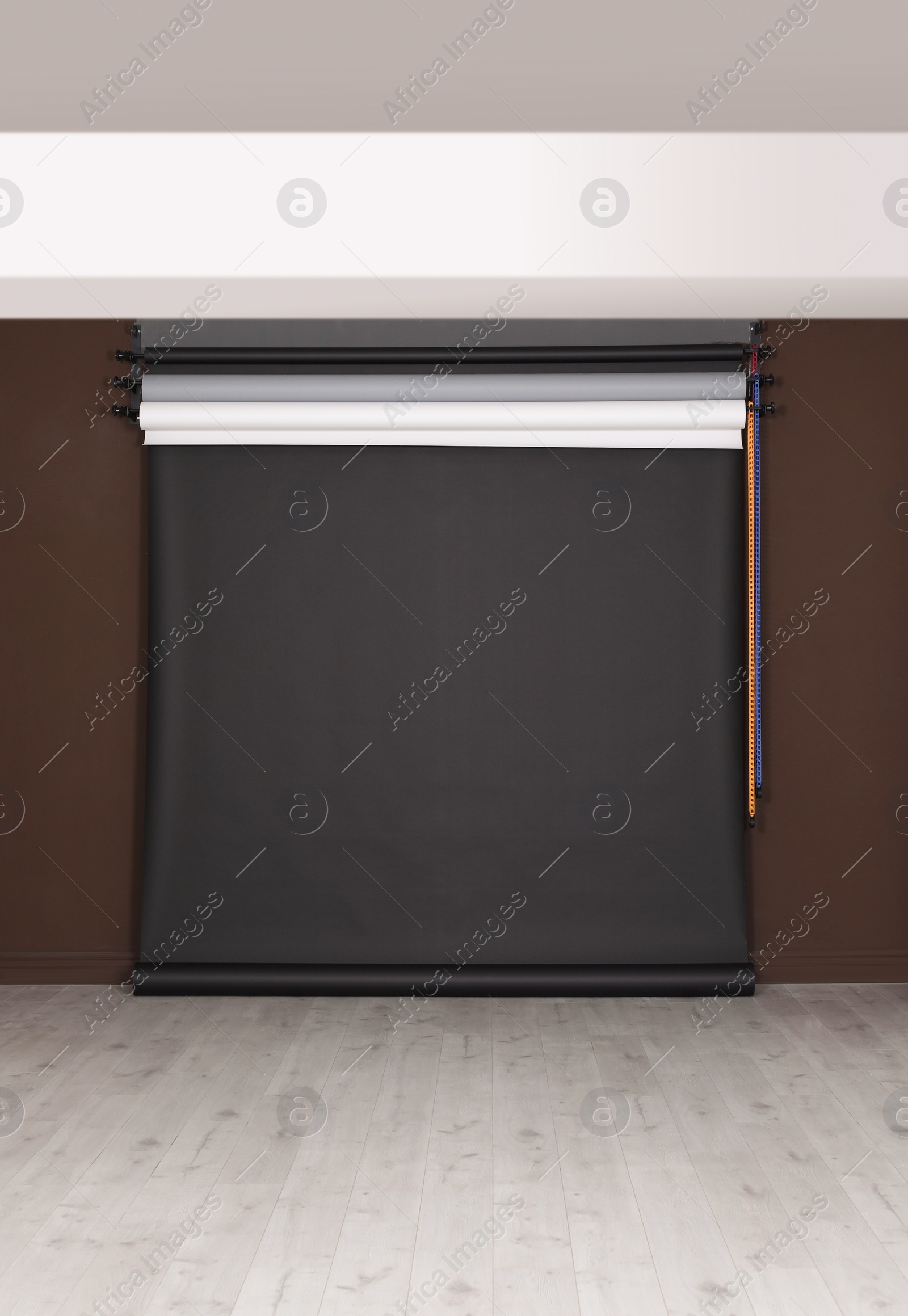 Photo of Empty black photo background. Professional studio equipment