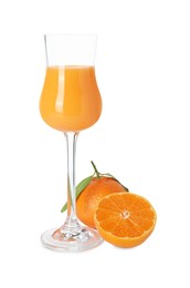 Photo of Glass with tasty tangerine liqueur and fresh fruit isolated on white