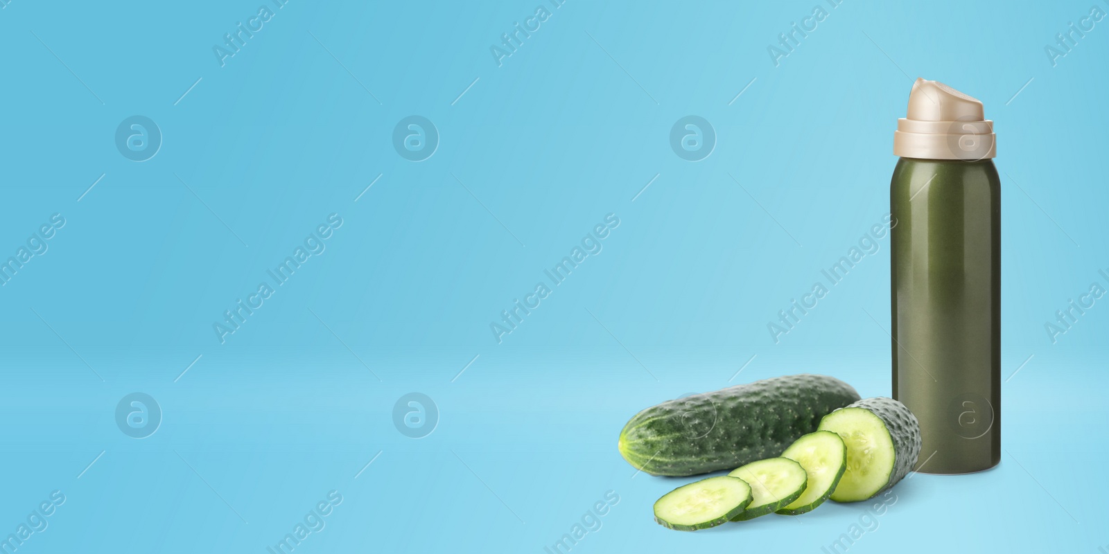 Image of Makeup remover and fresh cucumbers on blue background, banner design. Space for text 