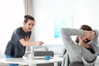Young couple having argument at home