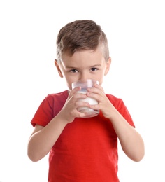 Cute little boy drinking milk on white background