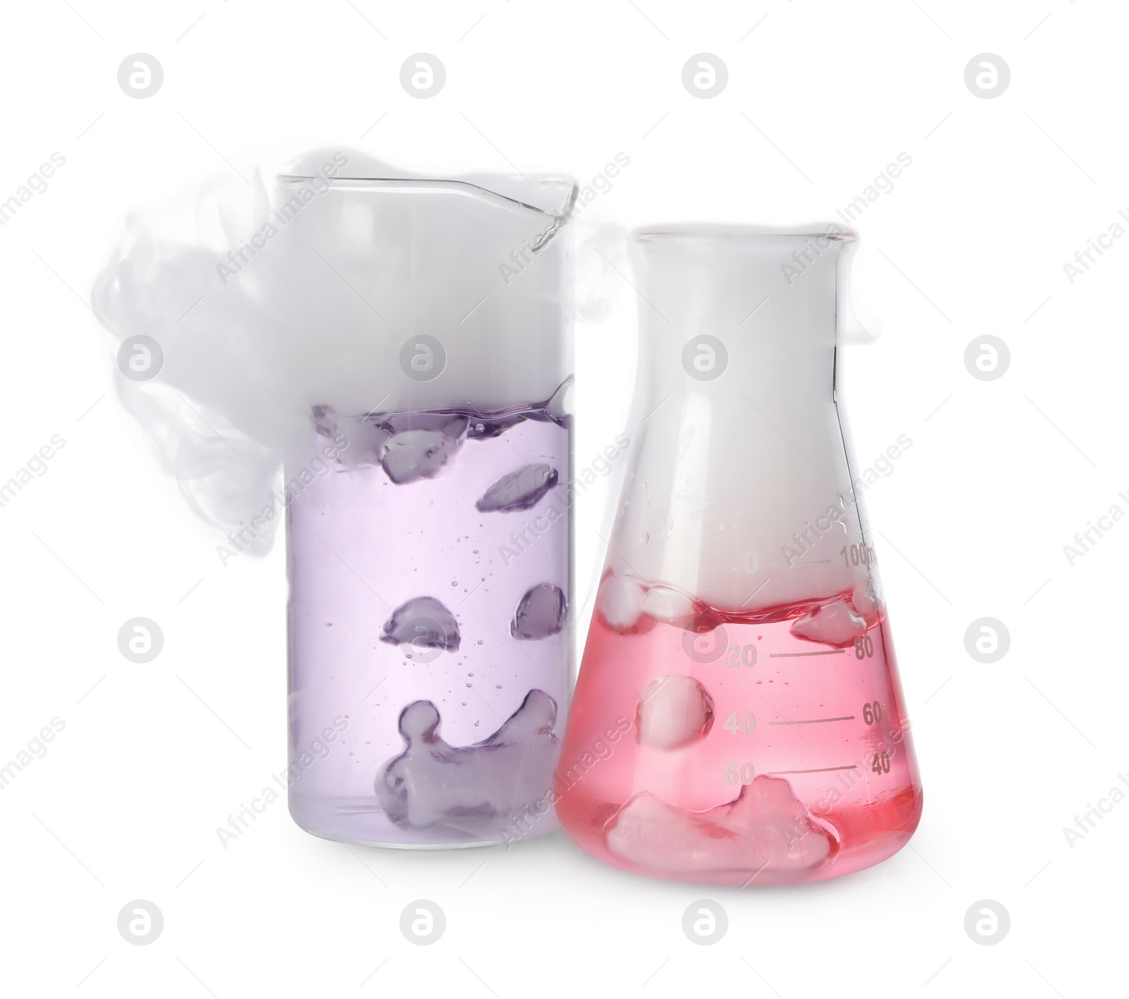 Photo of Laboratory glassware with colorful liquids and steam isolated on white. Chemical reaction