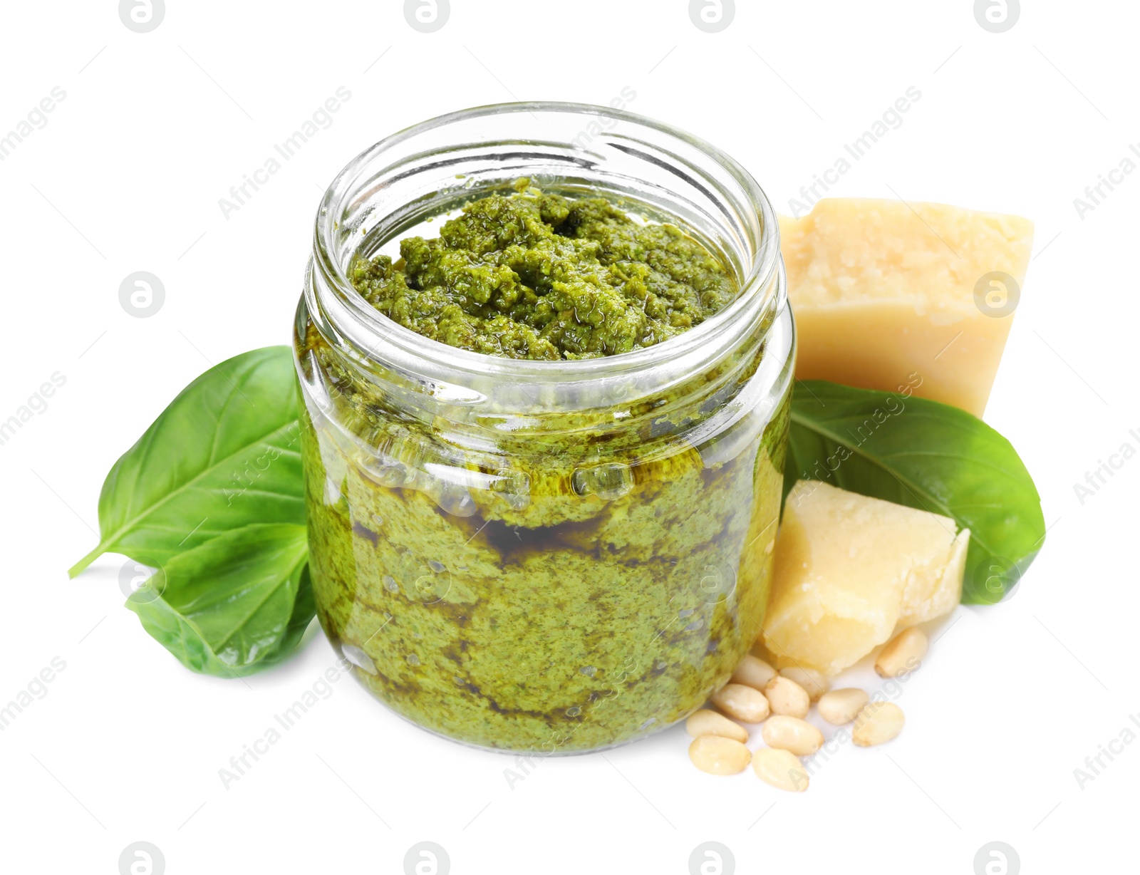 Photo of Fresh tasty pesto sauce, basil and cheese isolated on white