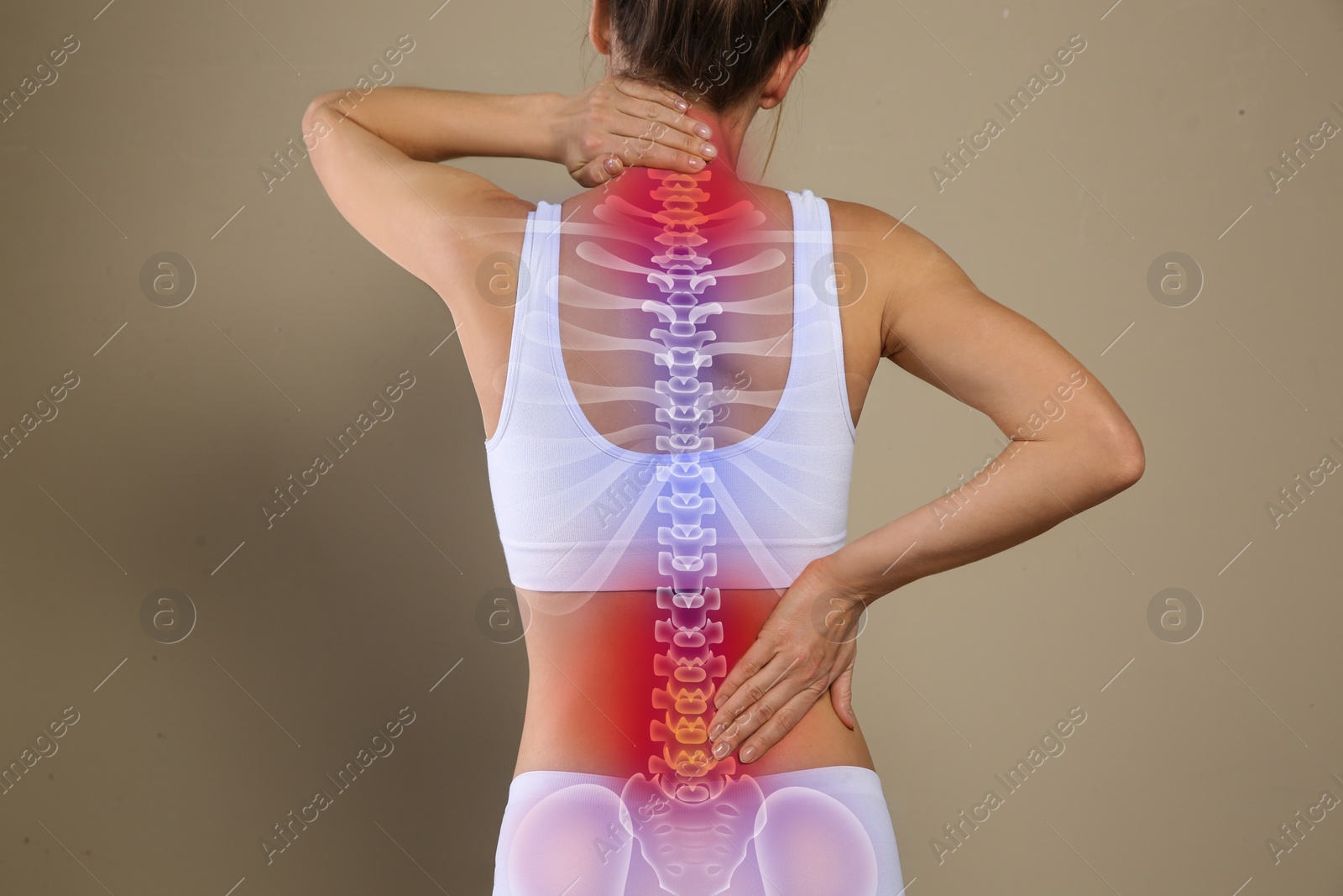 Image of Woman suffering from pain in back on beige background, closeup