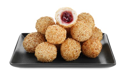 Many delicious sesame balls with red bean paste on white background