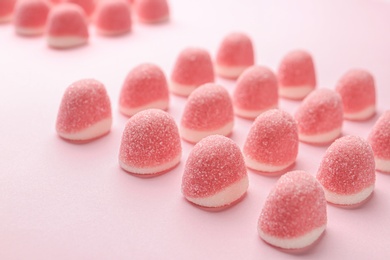 Photo of Sweet bright jelly candies on pink background