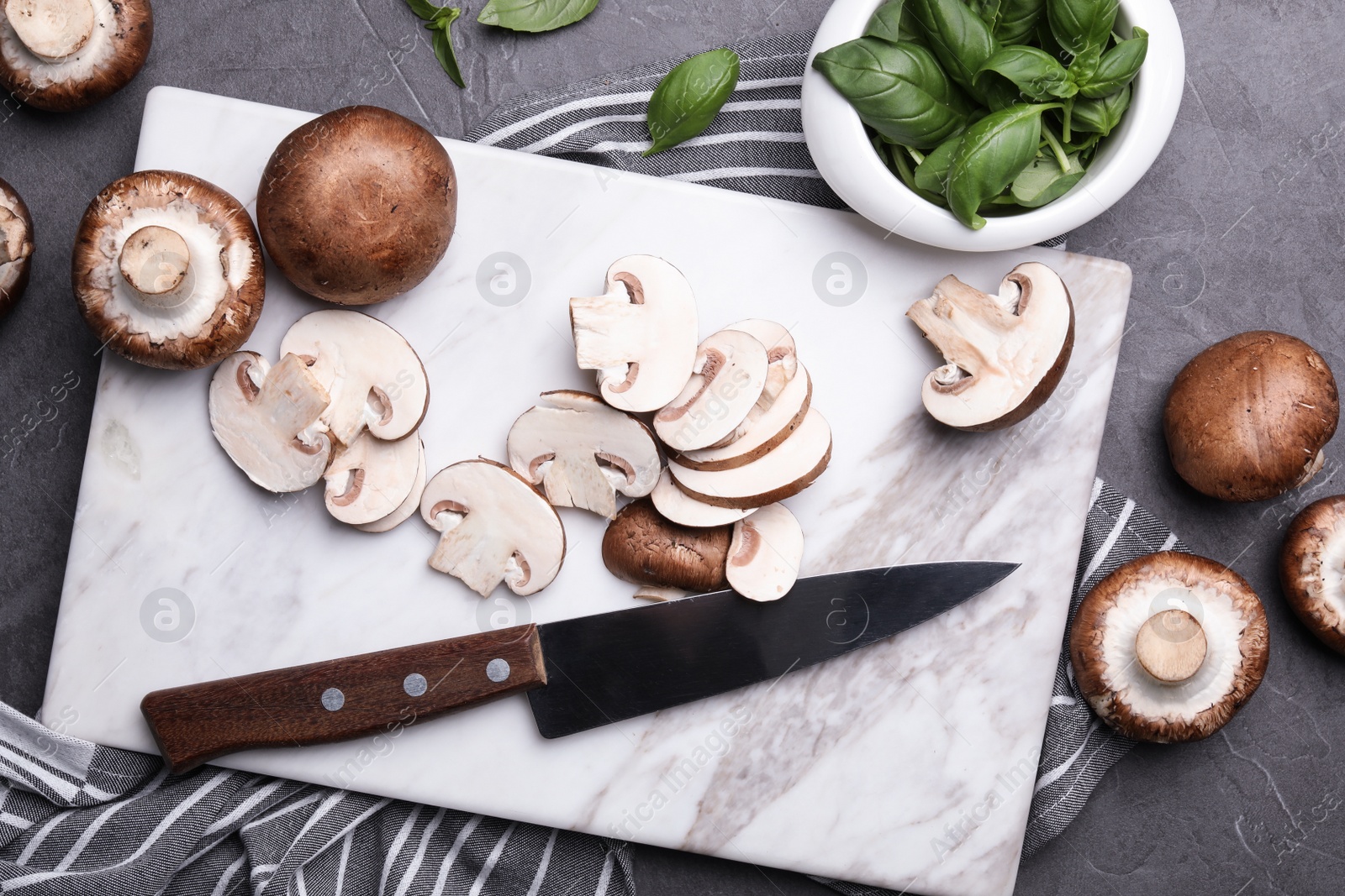 Photo of Flat lay composition with fresh raw mushrooms on table
