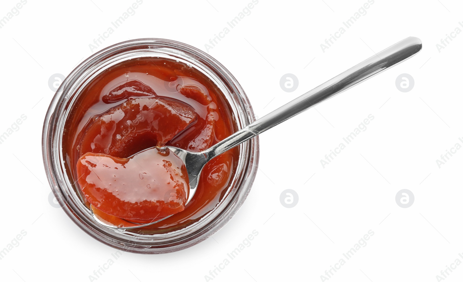 Photo of Tasty homemade quince jam in jar and spoon isolated on white, top view