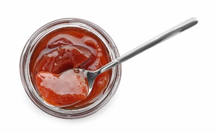 Photo of Tasty homemade quince jam in jar and spoon isolated on white, top view
