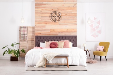 Modern interior design of cozy light bedroom